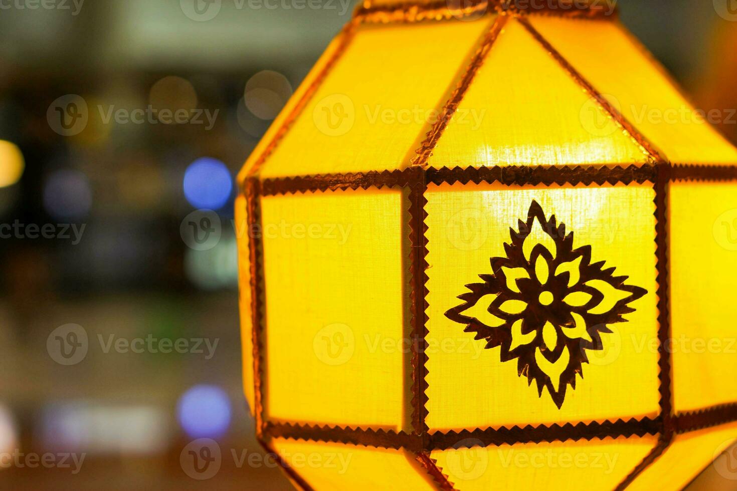 Closeup Colorful Thai Lanna style lanterns to hanging and turn on light at night. photo