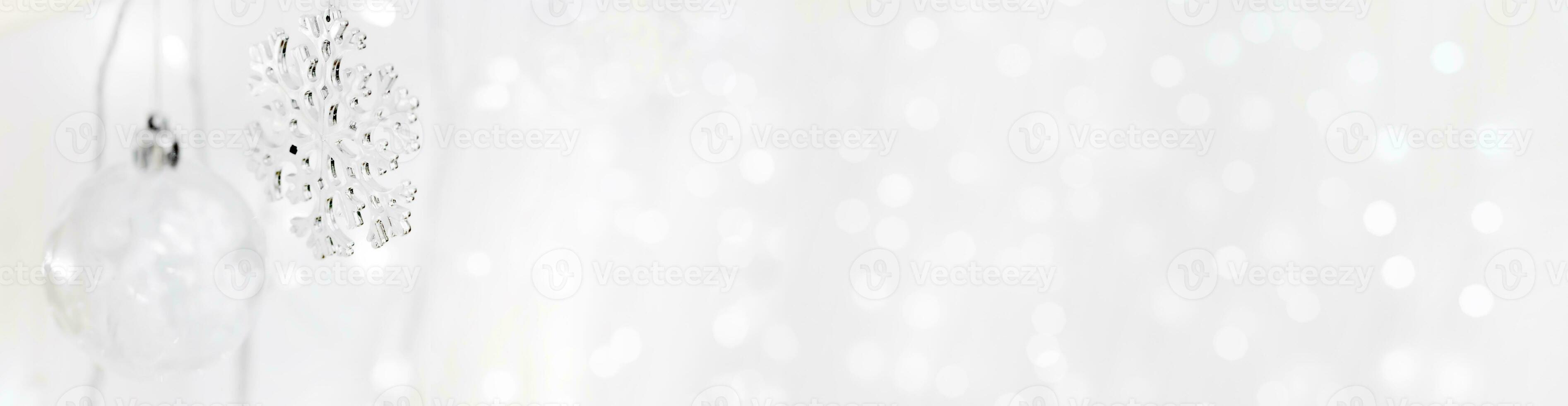 Transparent Christmas tree toy and snowflake on the background of garlands. Christmas background. Decorations for the Christmas tree. White background for new year. photo