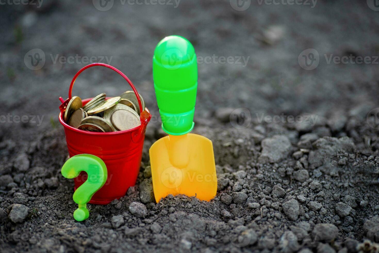 shovel and bucket of coins on ground. Earnings in agribusiness. way to make money in rural farm. Income in times of crisis. photo