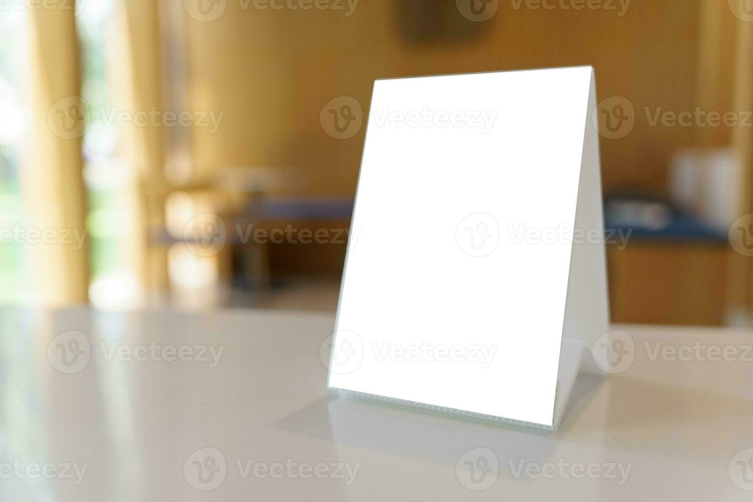 Mock up Menu frame standing on wood table in Bar restaurant cafe photo