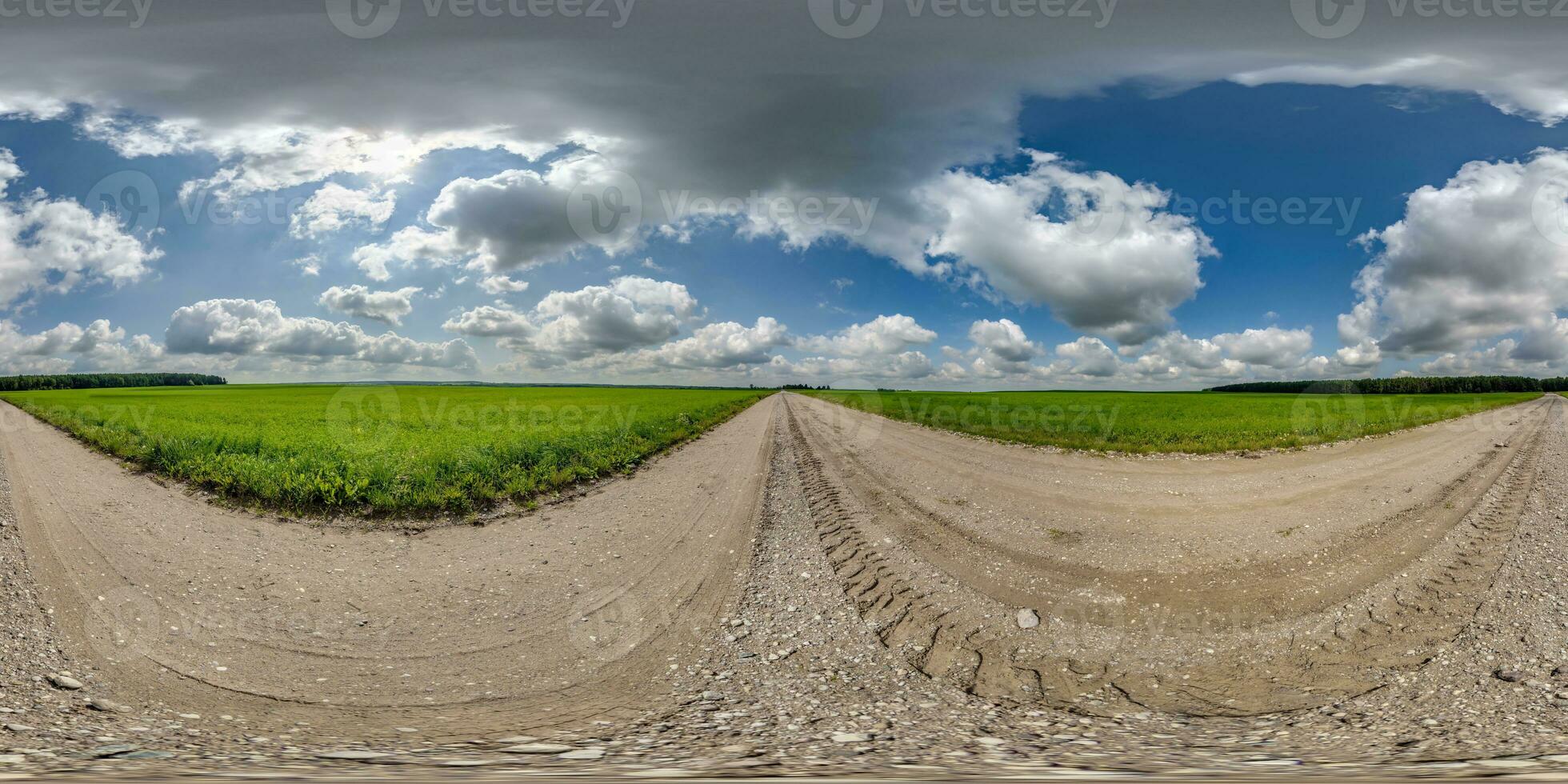 360 hdri panorama on gravel road with marks from car or tractor tires with clouds on blue sky in equirectangular spherical  seamless projection, skydome replacement in drone panoramas photo