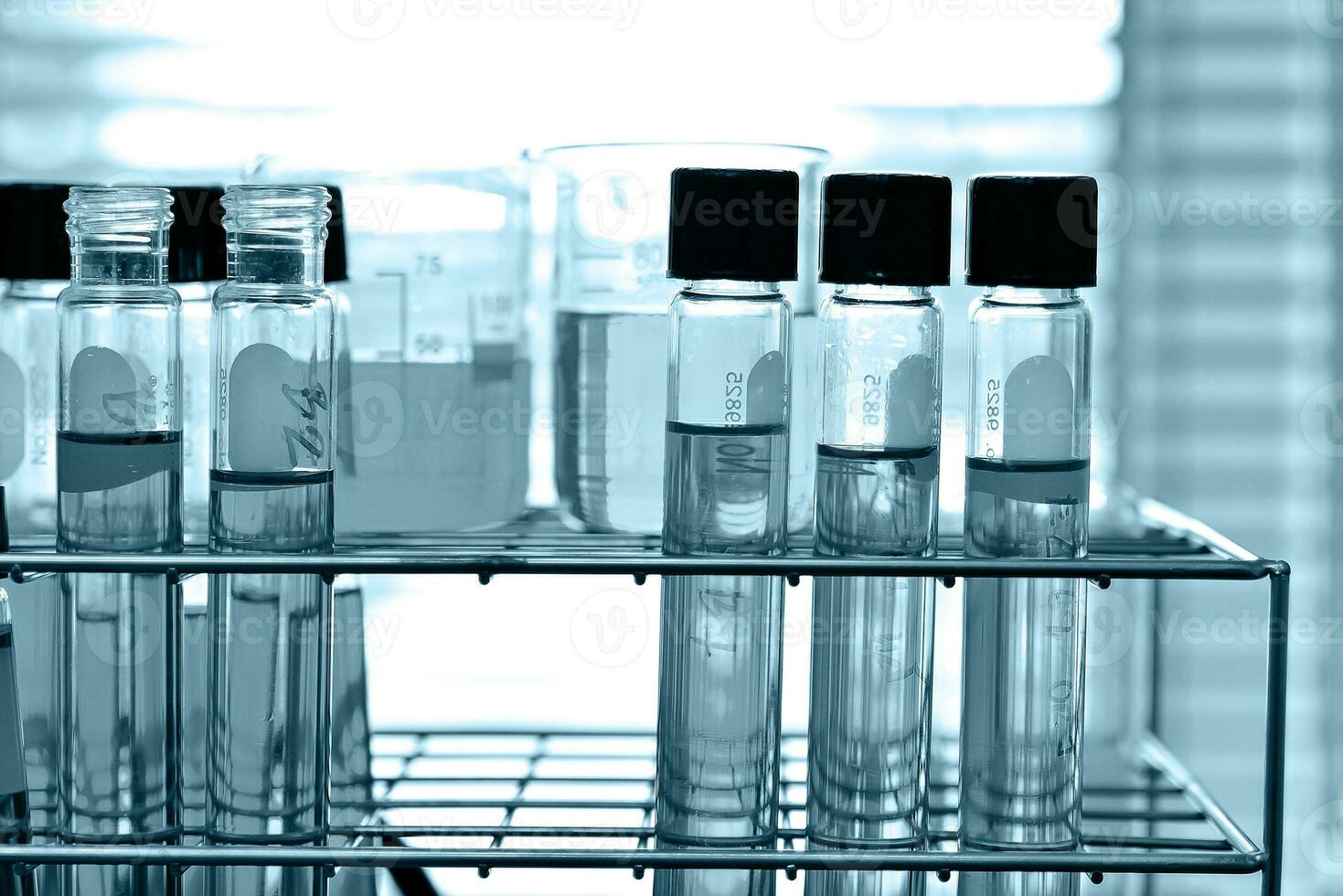 Laboratory glassware at lab background in blue tone photo