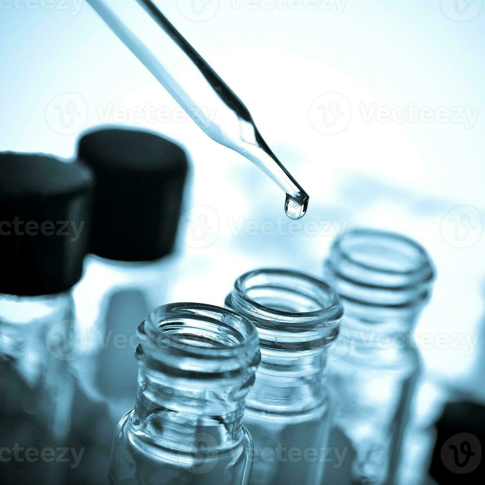 Laboratory glassware at lab background in blue tone photo