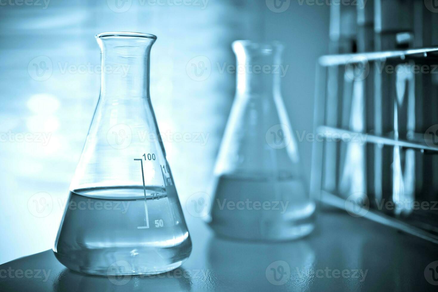 Laboratory glassware at lab background in blue tone photo