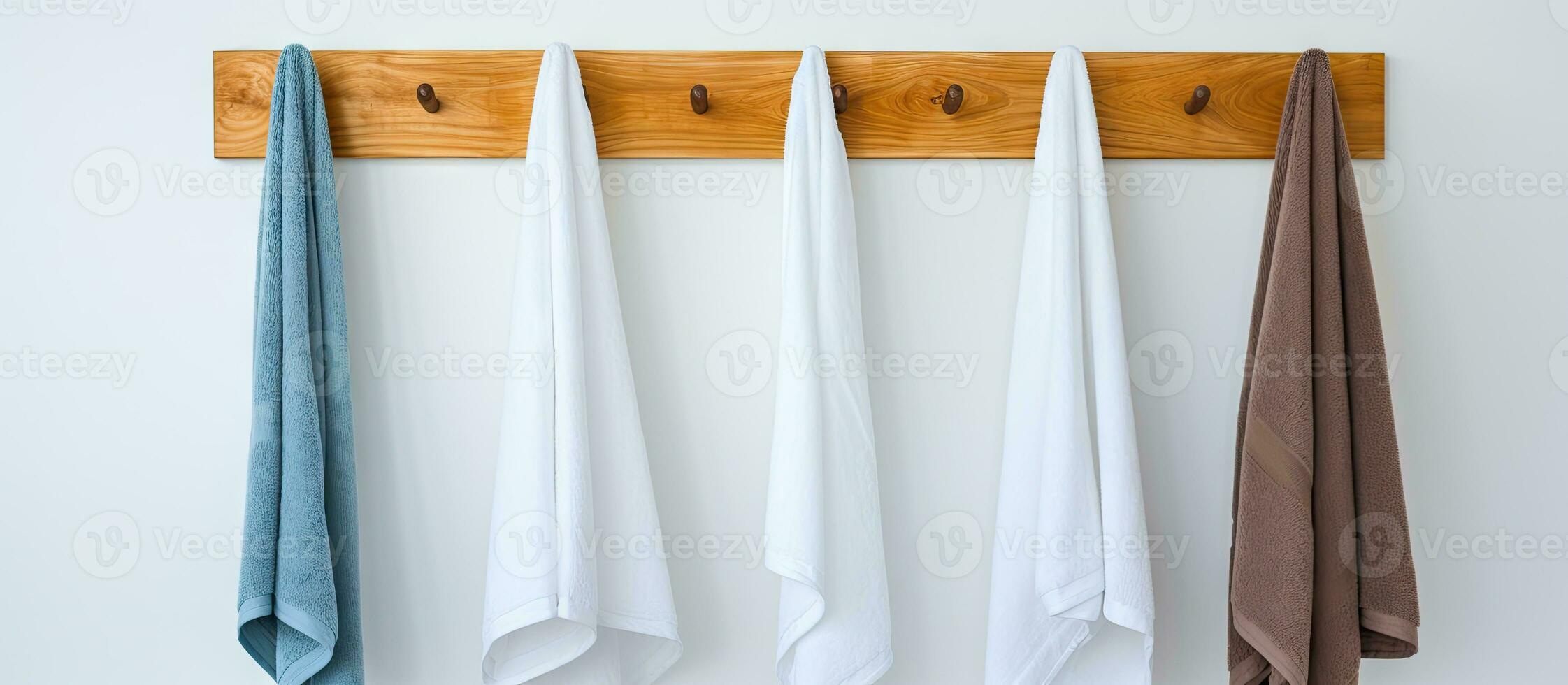 Hand towels hanging on a white wall photo