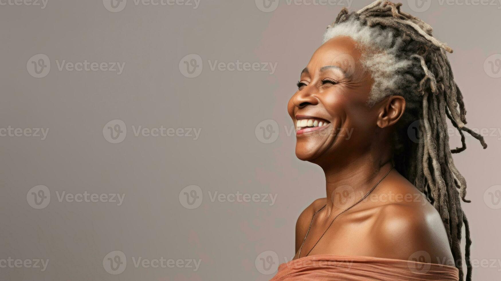 Happy mature african woman smiling cheerfully embracing her natural body with dreadlocks with copyspace AI Generated photo