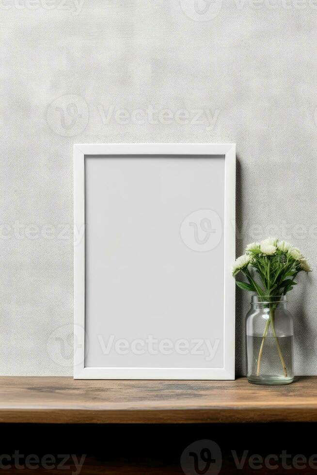 Blank vertical picture frame mockup hanging on a plain wall with wooden desk table and flower vase AI Generated photo
