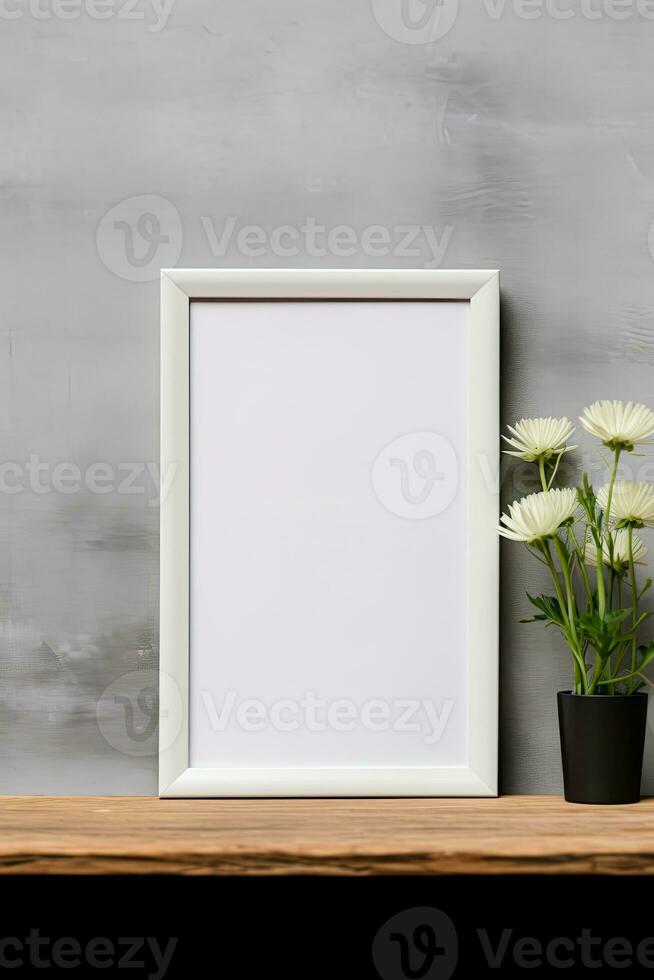 Blank vertical picture frame mockup hanging on a plain wall with wooden desk table and flower vase AI Generated photo