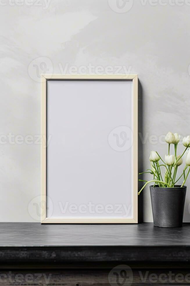 Blank vertical picture frame mockup hanging on a plain wall with wooden desk table and flower vase AI Generated photo