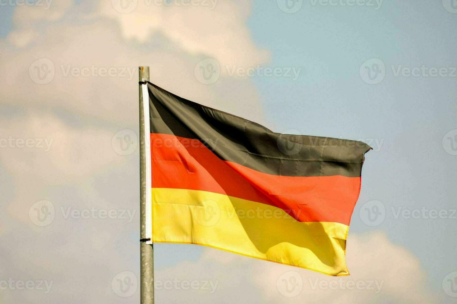 the german flag is flying high in the sky photo