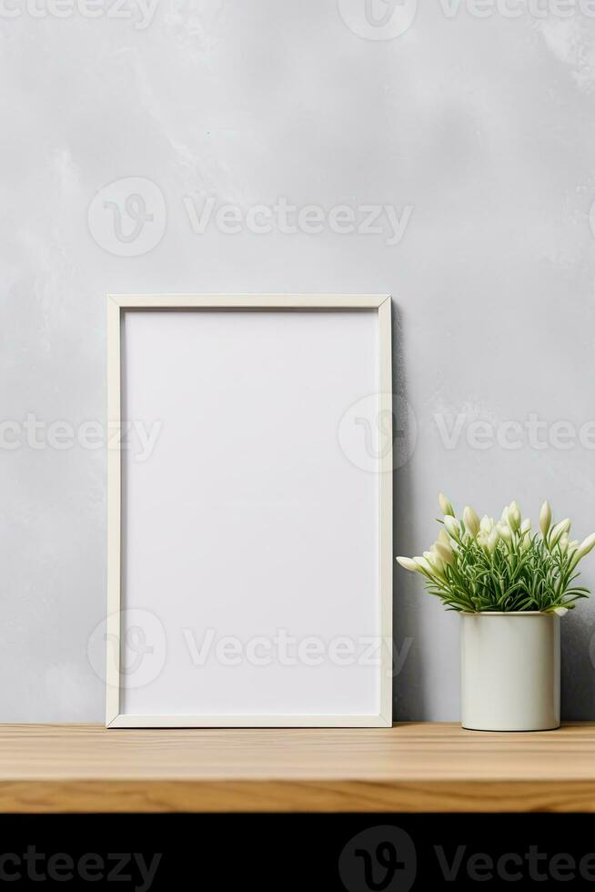 Blank vertical picture frame mockup hanging on a plain wall with wooden desk table and flower vase AI Generated photo