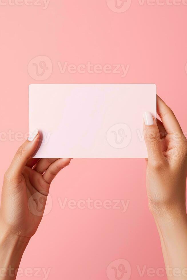 Female hands with blank business card or discount card on Flat color background with copy space AI Generated photo