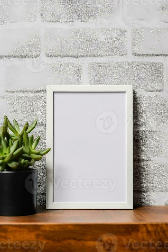 Empty vertical picture frame mockup hanging on a brick wall with wooden desk table and flower vase AI Generated photo