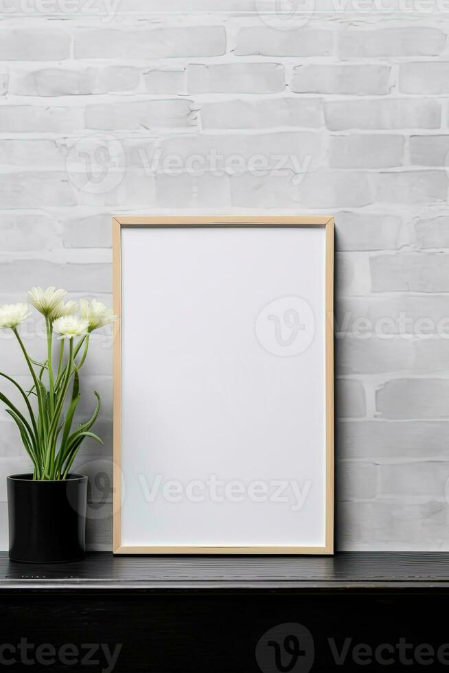 Empty vertical picture frame mockup hanging on a brick wall with wooden desk table and flower vase AI Generated photo