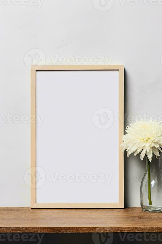 Blank vertical picture frame mockup hanging on a plain wall with wooden desk table and flower vase AI Generated photo