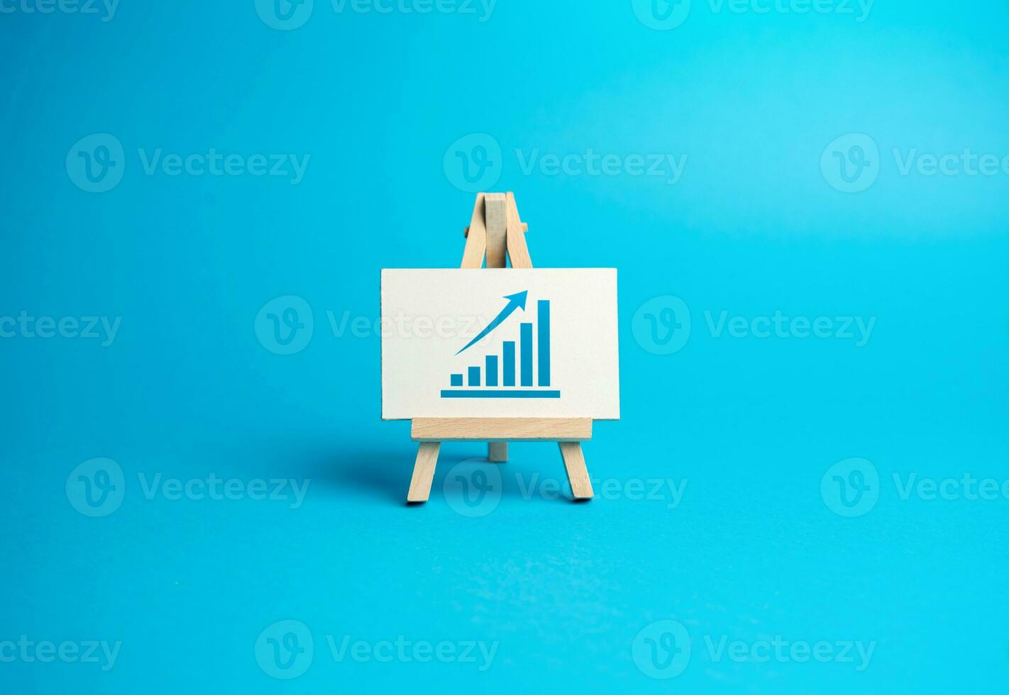 Easel with a up trend graph. Expanding operations, entering new markets. Financial planning and analysis. High income on deposits and investments. Capital increase. Growth and prosperity. photo