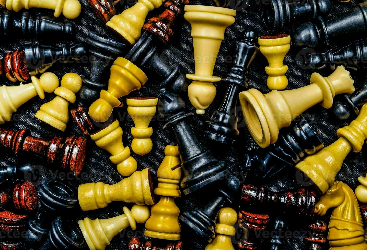 many different colored chess pieces are arranged together photo