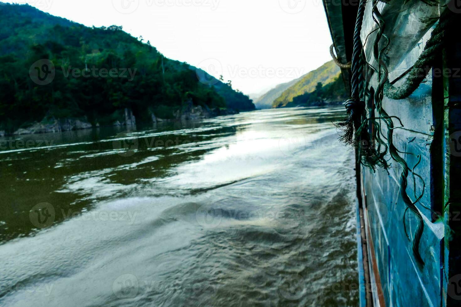 a view from the side of a boat on a river photo