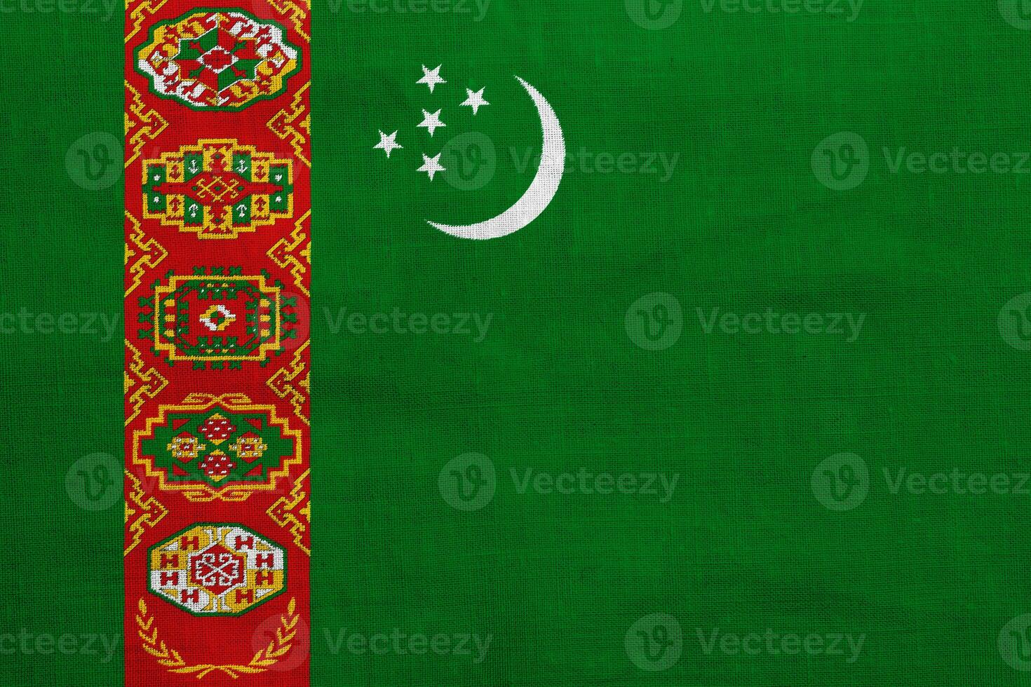 bandera de Turkmenistán en un texturizado antecedentes. concepto collage. foto