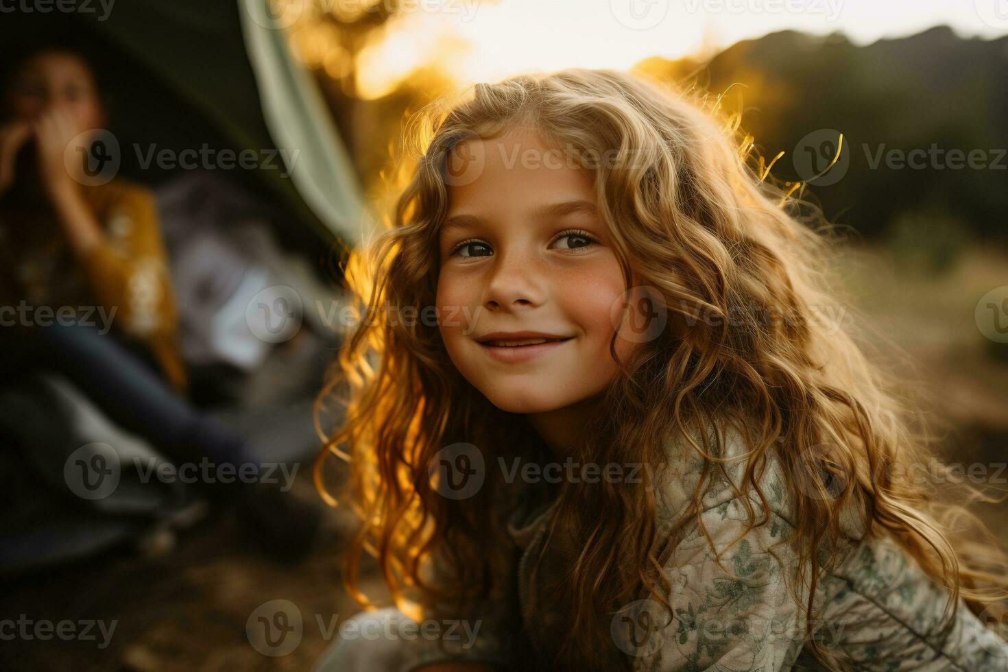 Portrait of cute little girl at camera while standing near camping tent at sunset AI generated photo