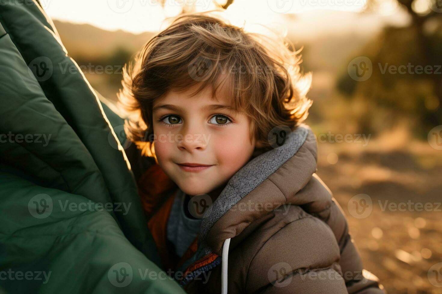 Portrait of a cute boy looking at camera while near his tent in nature AI generated photo