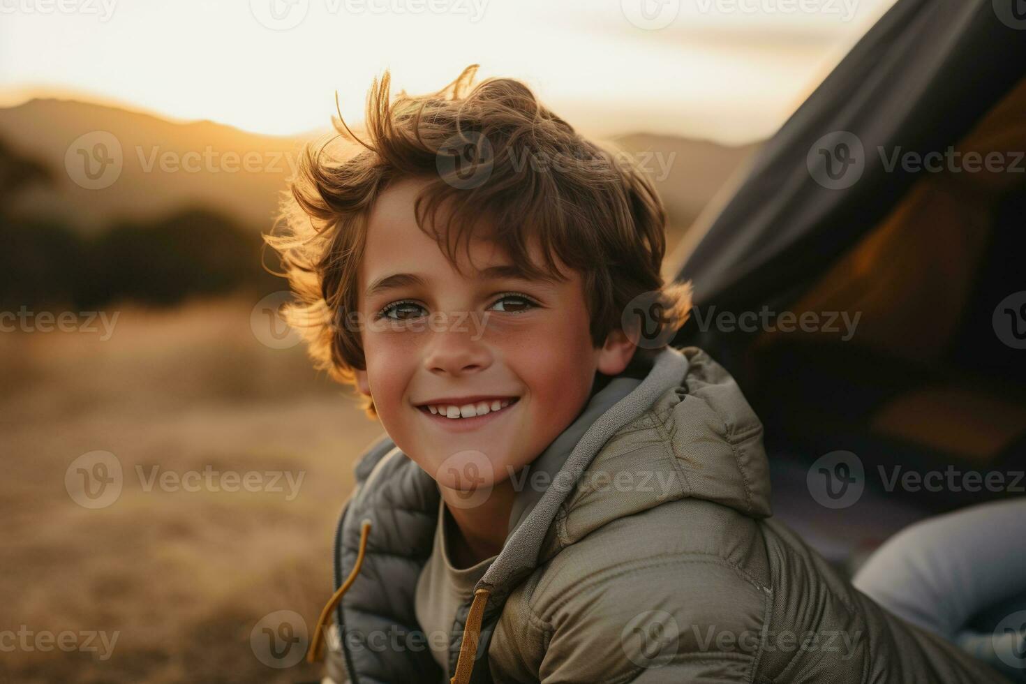 Portrait of a cute boy looking at camera while near his tent in nature AI generated photo