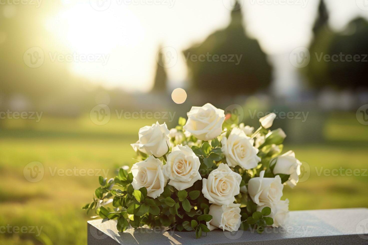 white flowers in front of a gravestone at a cemetery with sunset.Funeral Concept AI generated photo