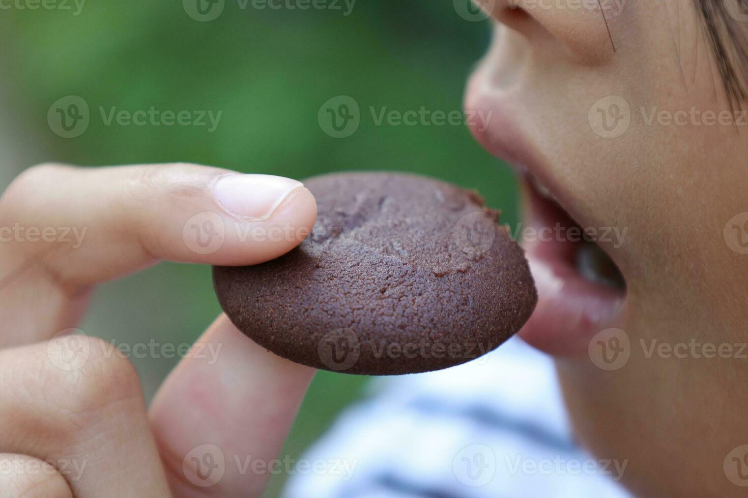 Close-up view of mouth eating food photo