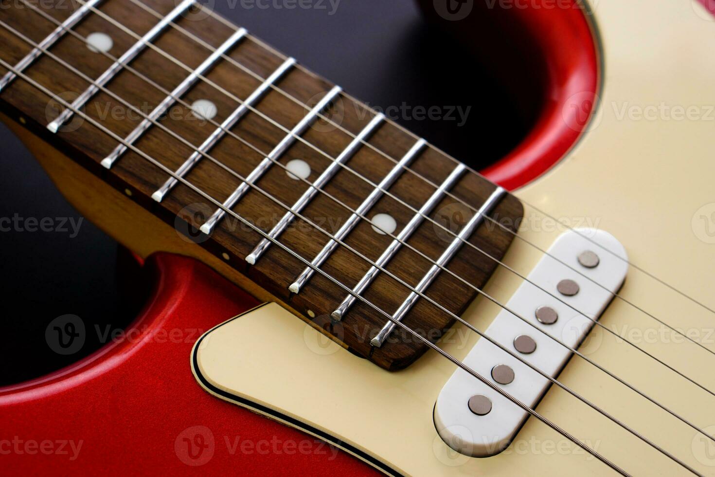 Electric guitar body isolated on black background. Entertainment and music concept. photo