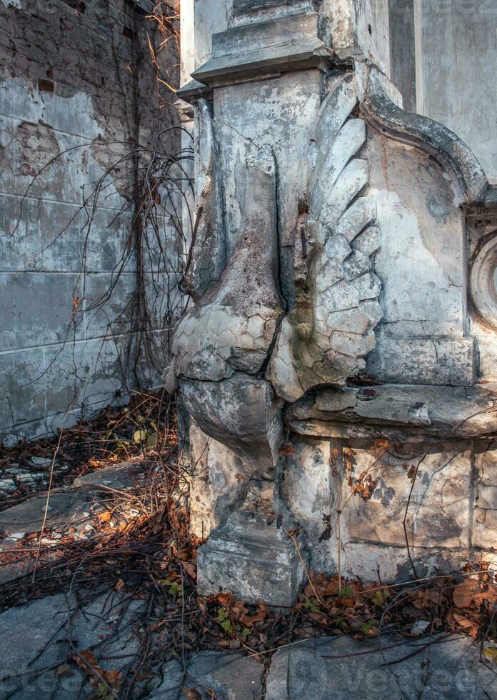 Destroyed swan statue on the yard concept photo. Castle ruins terrace view. photo