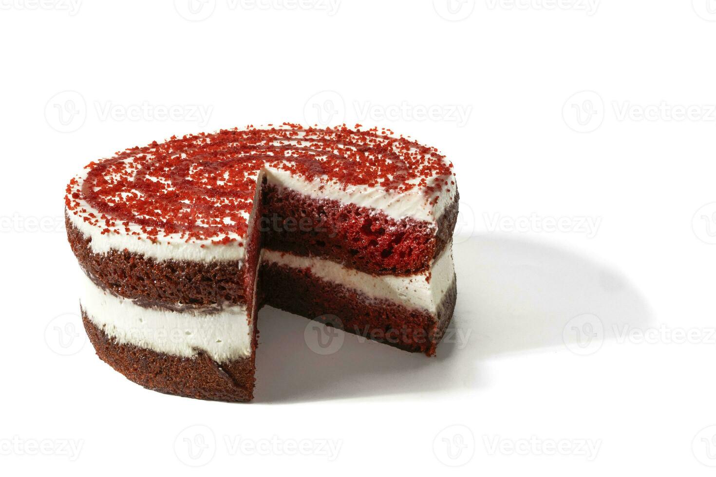 A red velvet cake, isolated on a white background. A red velvet cake is a soft red velvet treat with a perfect balance of sweet and tart, topped with a silky, creamy layer of cream cheese frosting. photo