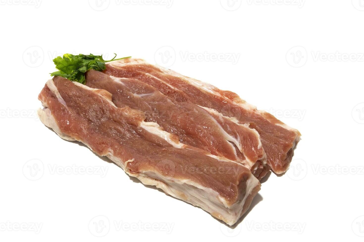 Three pieces of raw pork ,Iberian lizard, joined between the backbone and the loin. Isolated on a white background. Spanish food concept. photo