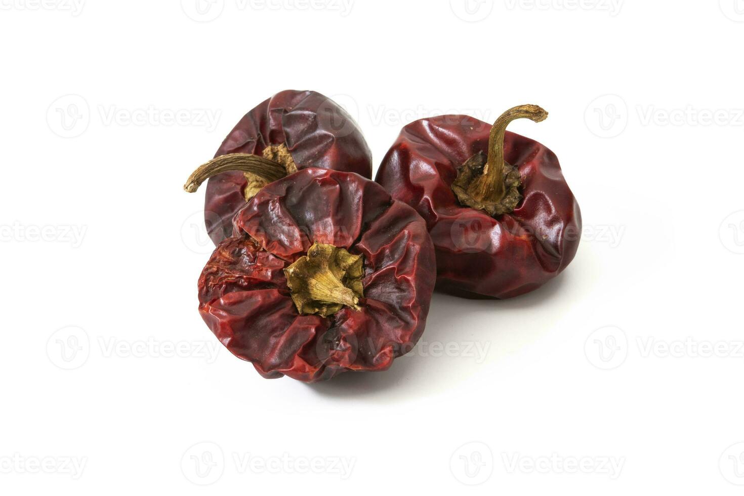 Nora isolated on a white background. The nora is a cultivated variety of Capsicum annuum or pepper, called ball in Alicante ,Spain. Small in size, red when ripe, which is left to dry in the sun. photo