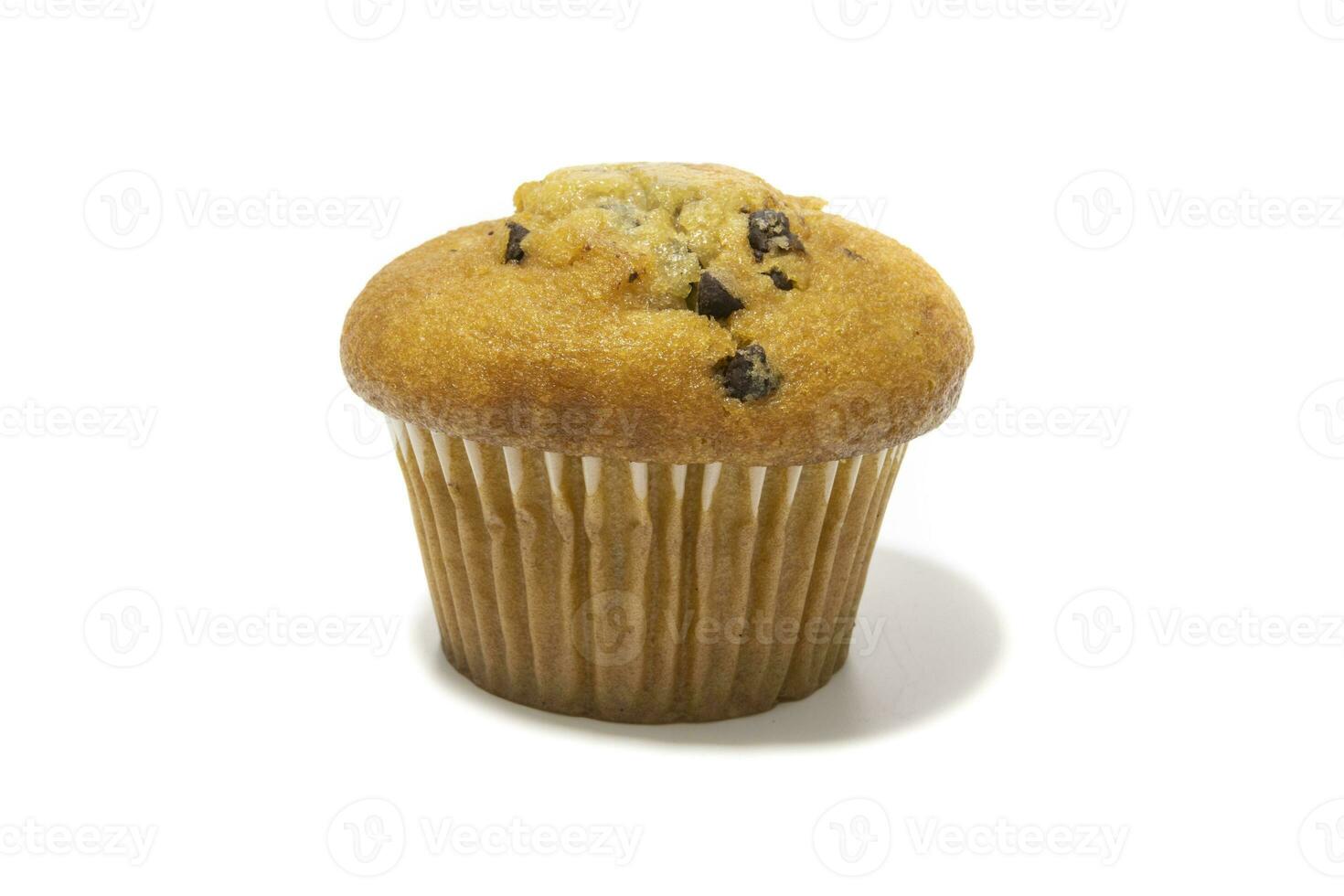 Muffins with chocolate flecks isolated on a white background. Muffins are made mainly from wheat flour, egg, vegetable oil, cow's milk, baking powder, essence ,vanilla being the most common, and sugar photo