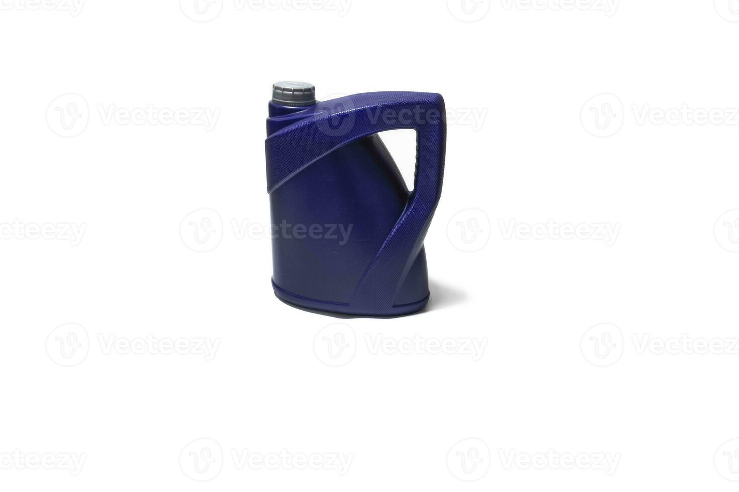 Motor oil bottle isolated on a white background. Motor oil is made up of a mineral or synthetic base and additives that provide it with the necessary properties to protect the engine. photo