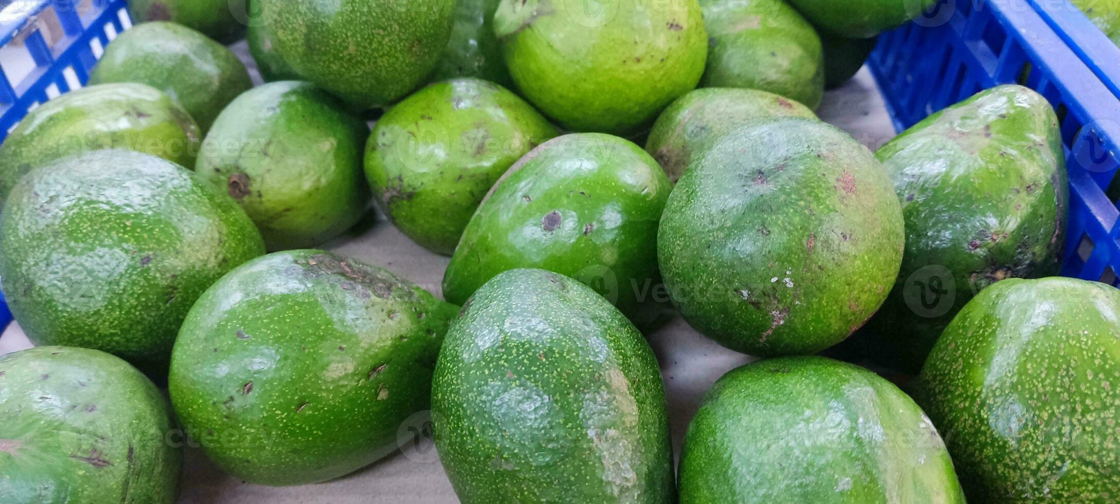 Avocado also refers to the Avocado tree's fruit, which is botanically a large berry containing a single seed. Avocados are very nutritious and contain a wide variety of nutrients. photo