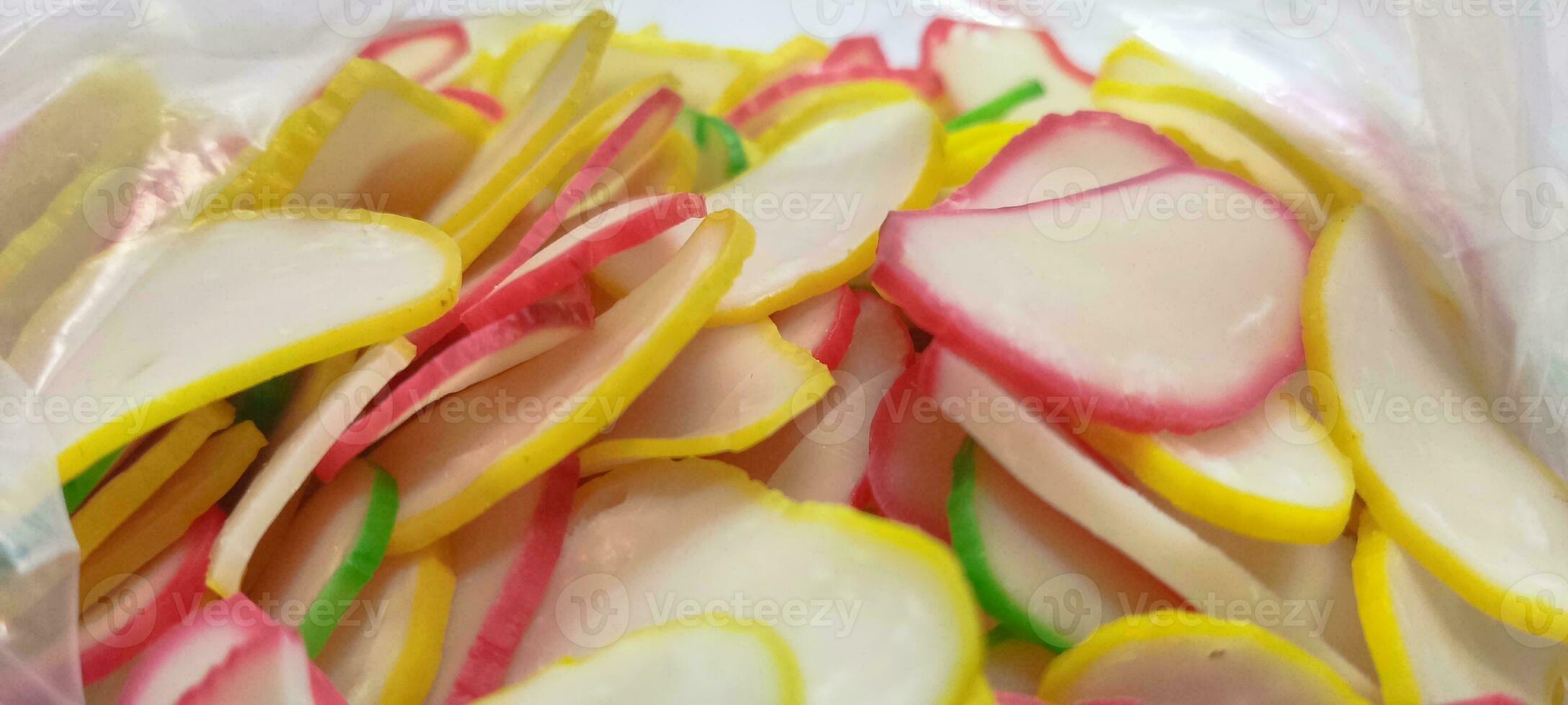 The photo of kerupuk is a typical Indonesian raw food with various colors and photographed up close.