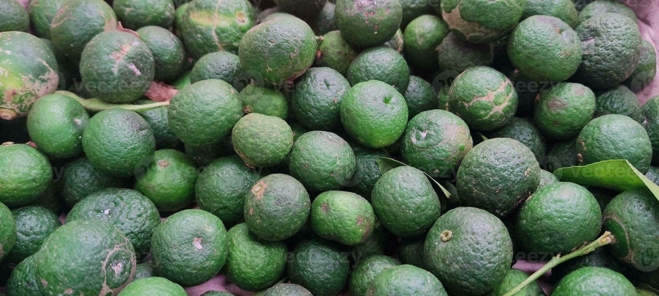 green small lemon fresh from market photo