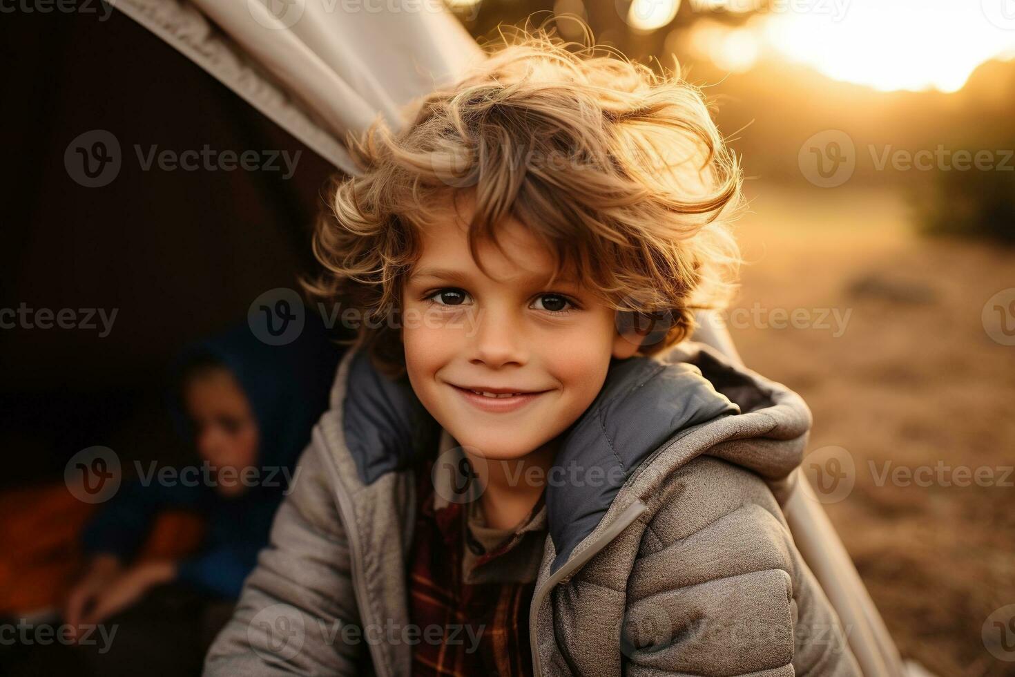 Portrait of a cute boy looking at camera while near his tent in nature AI generated photo