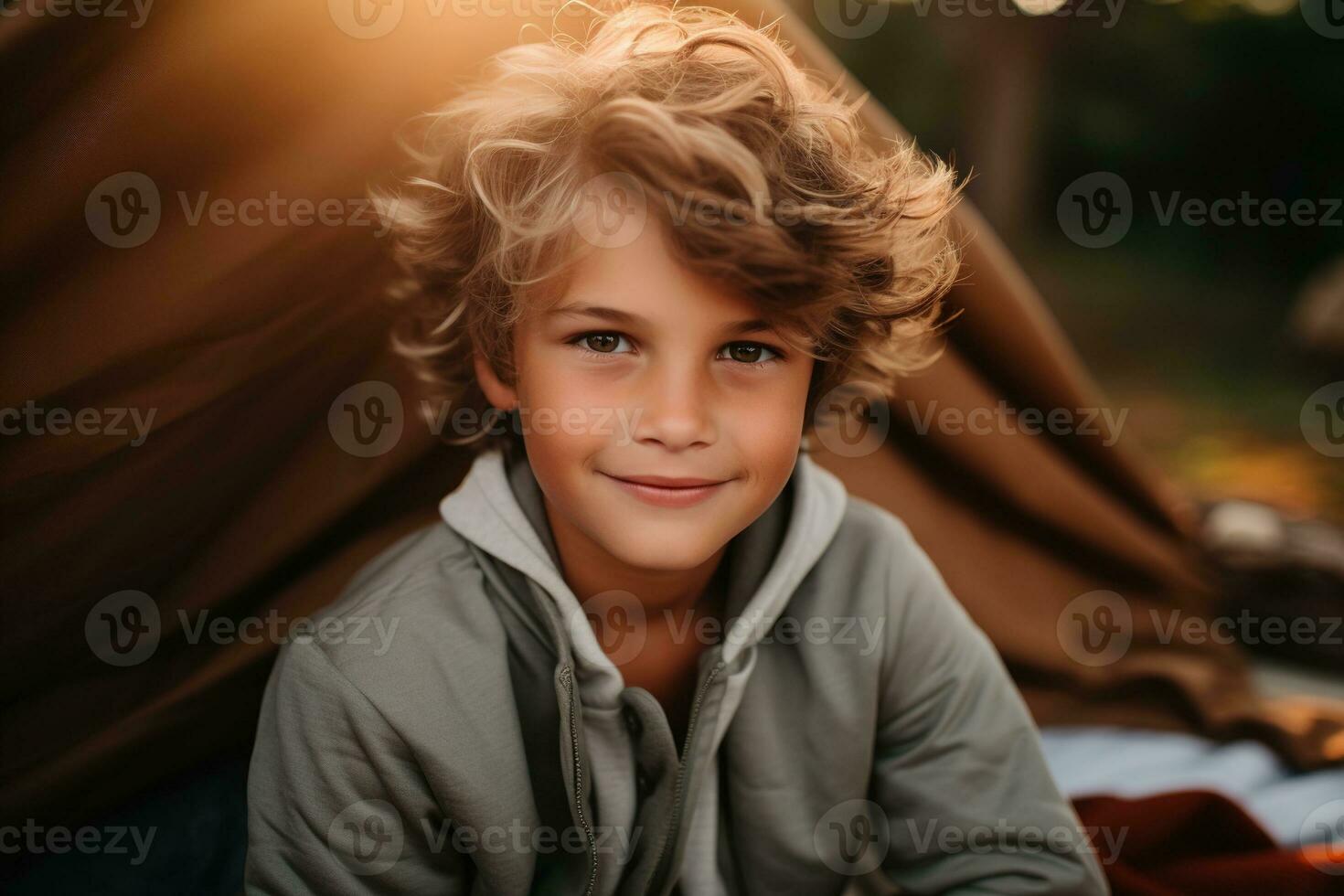 Portrait of a cute boy looking at camera while near his tent in nature AI generated photo