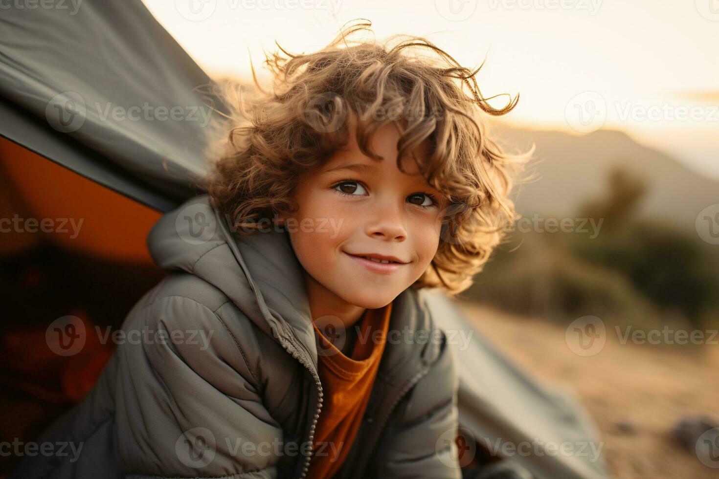 Portrait of a cute boy looking at camera while near his tent in nature AI generated photo
