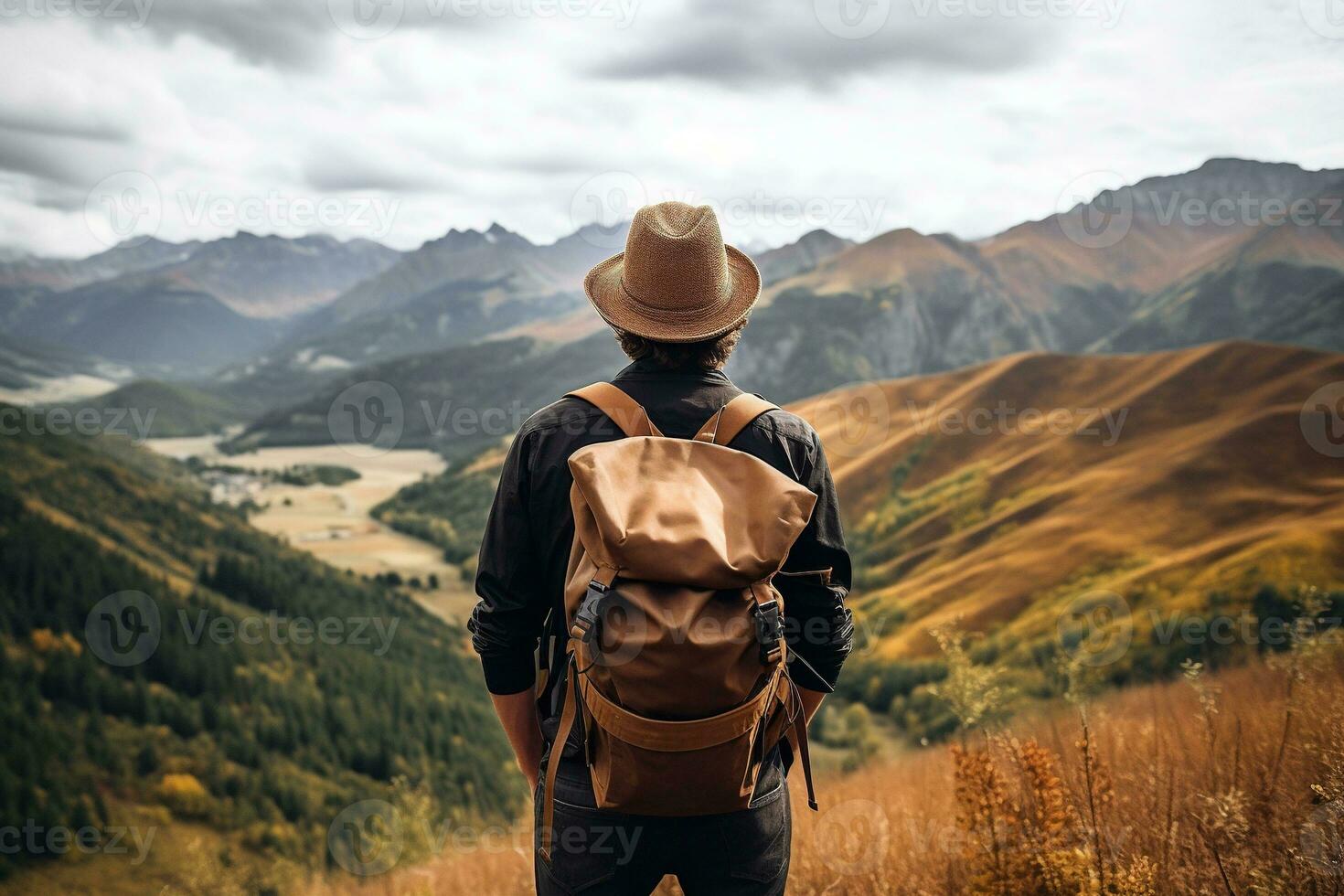 Hipster traveler with backpack sitting on top of a mountain and looking at the valley. AI generated photo