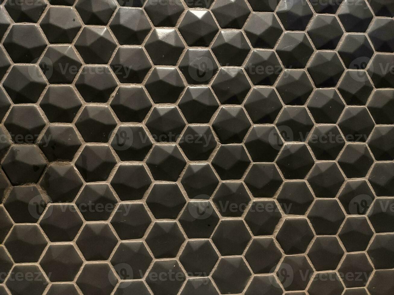 Texture of glossy black mosaic tiles hexagon photo