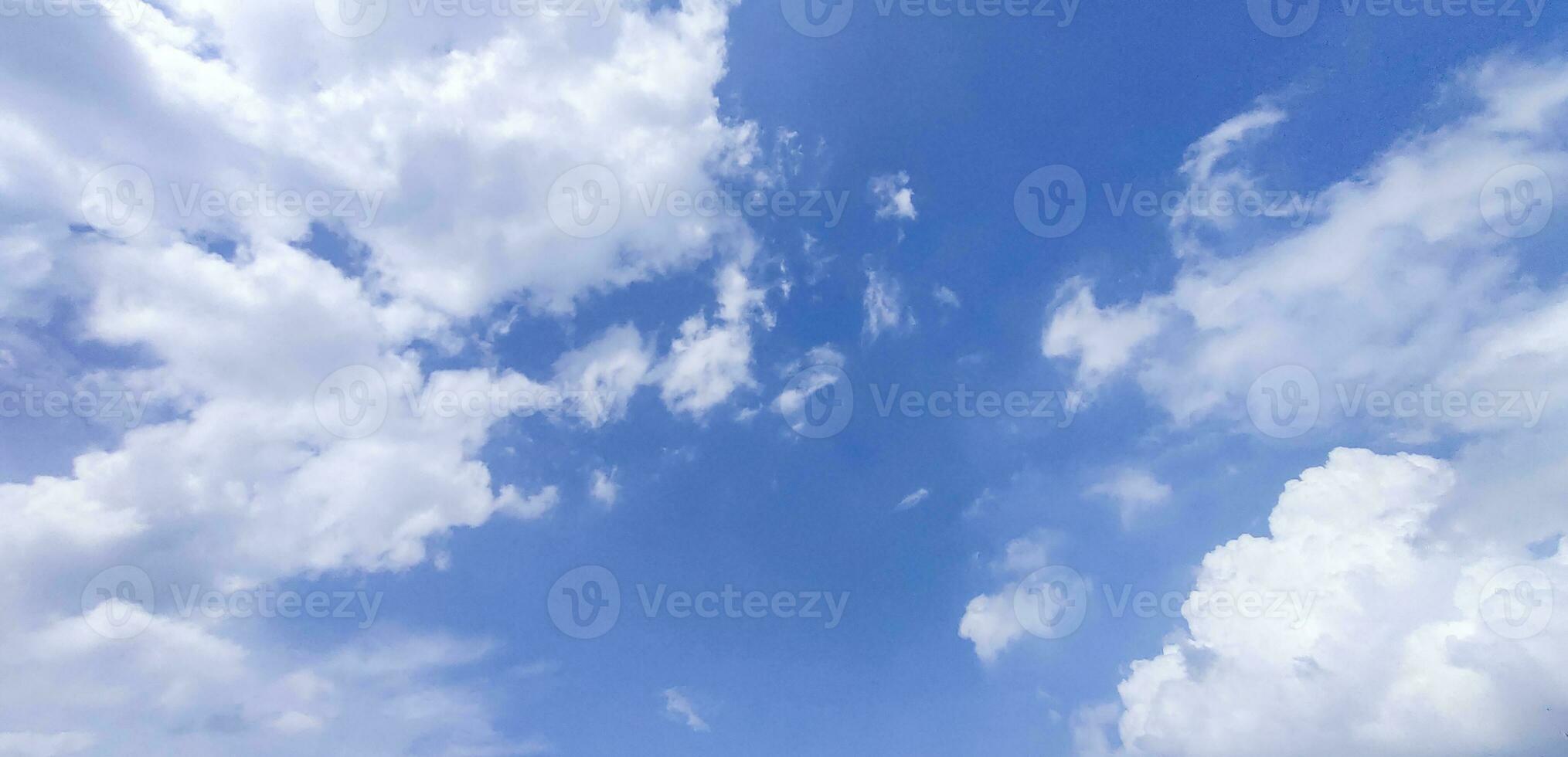 a blue sky with clouds and a blue sky, Blue sky and white cloud clear summer view, a large white cloud is in the sky, a blue sky with clouds and some white clouds photo