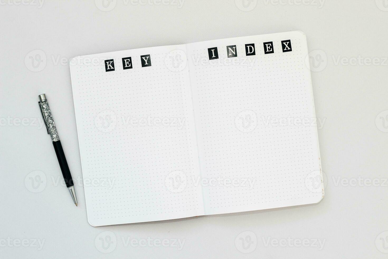 Filling in the diary, the inscription Key, Index in a dot notebook photo