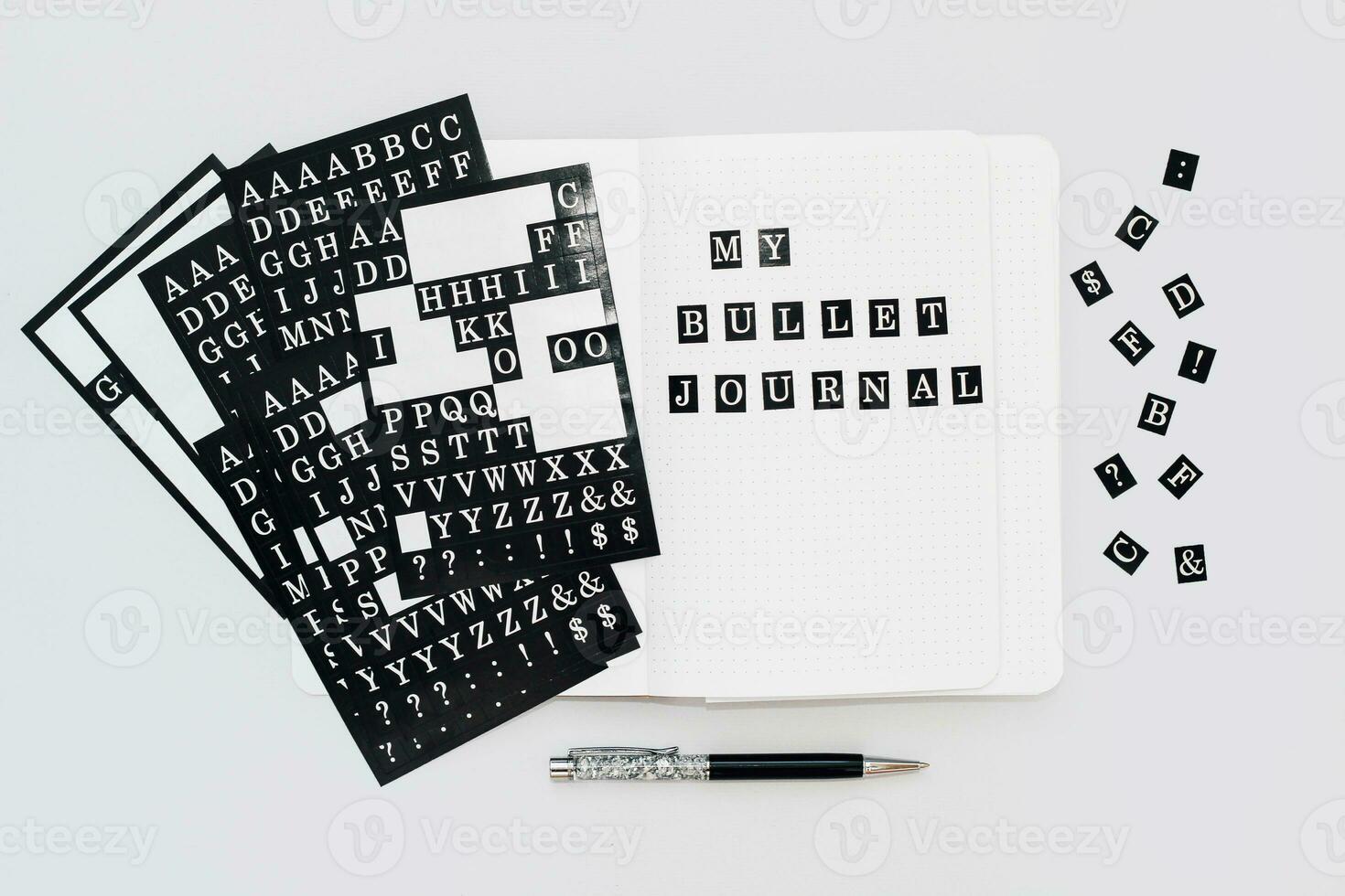 Stickers are white on a black background, letter symbols and punctuation marks photo