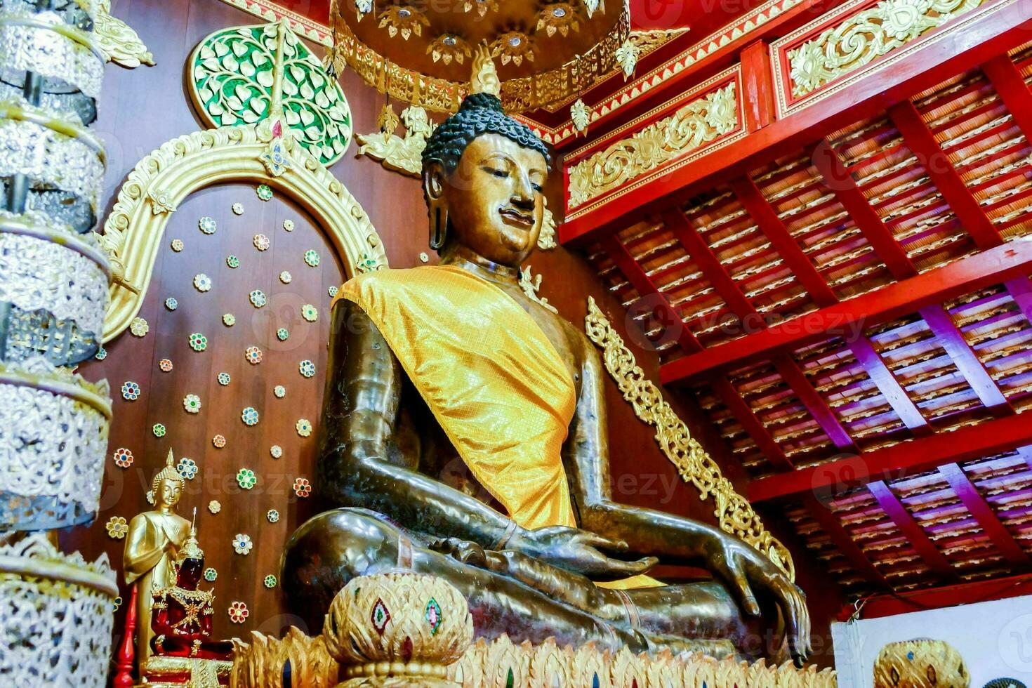 a large buddha statue in a temple photo