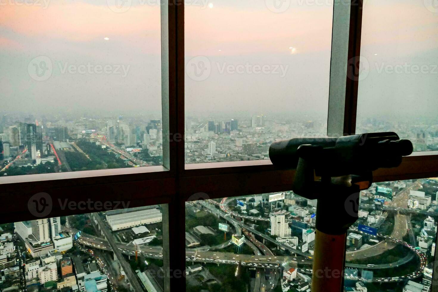 a view of the city from the top of a building photo