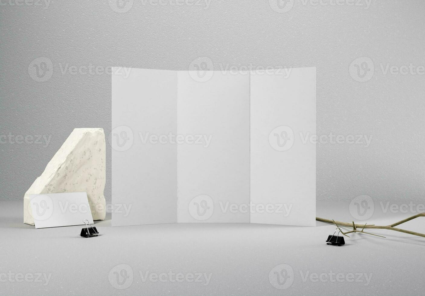 Blank trifold brochure and business card with concrete background, great for brochure mockups. photo