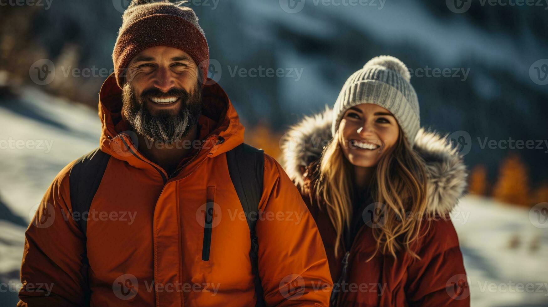 Active couple enjoying a winter hike in scenic snow covered mountains photo
